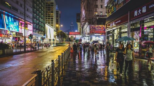 Wet illuminated city at night