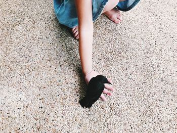 Low section of child on bird