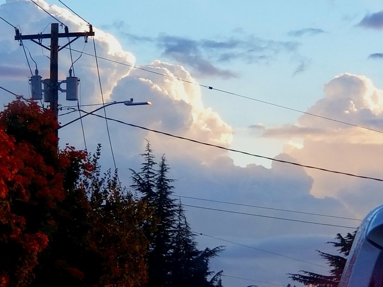 LOW ANGLE VIEW OF POWER LINES AGAINST BUILDING