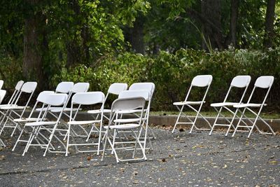 Empty chairs on field