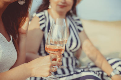 Portrait of woman holding wineglass