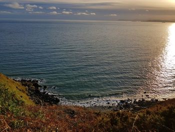 Scenic view of sea against sky during sunset