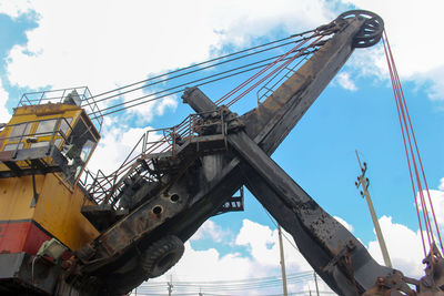 Low angle view of construction site against sky