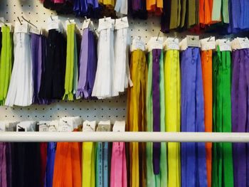 Close-up of colorful clothes hanging for sale