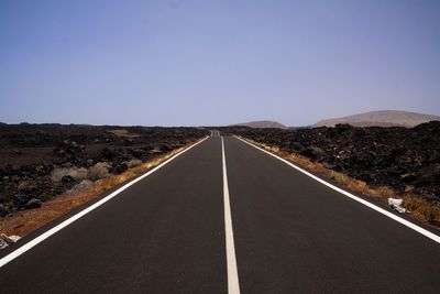 Empty road along landscape