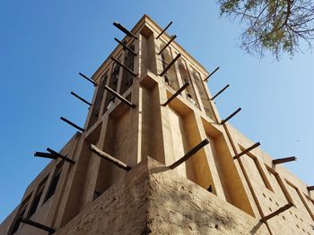 Low angle view of bell tower against sky