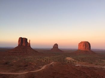 Scenic view of desert against sky during sunset