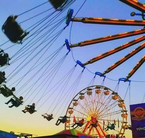 Low angle view of ferris wheel against sky