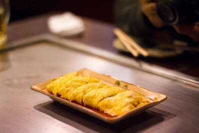 Close-up of served food on table