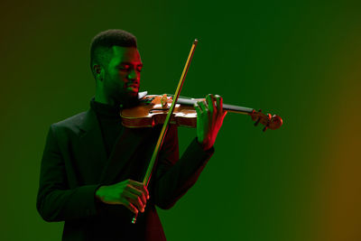 Young man playing violin