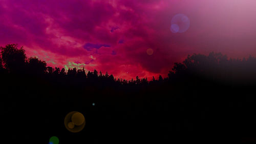 Scenic view of landscape against dramatic sky