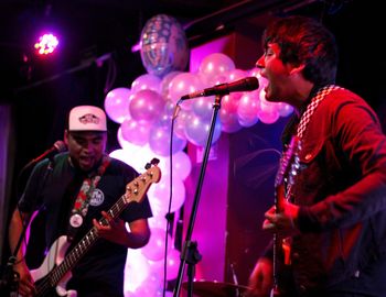 Group of people playing guitar at music concert