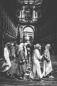 People in front of historic building