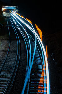 High angle view of light trails on road at night