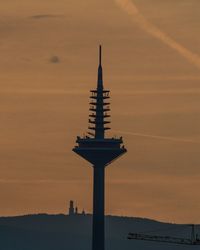 Low angle view of silhouette building against sky during sunset in frankfurt, germany 