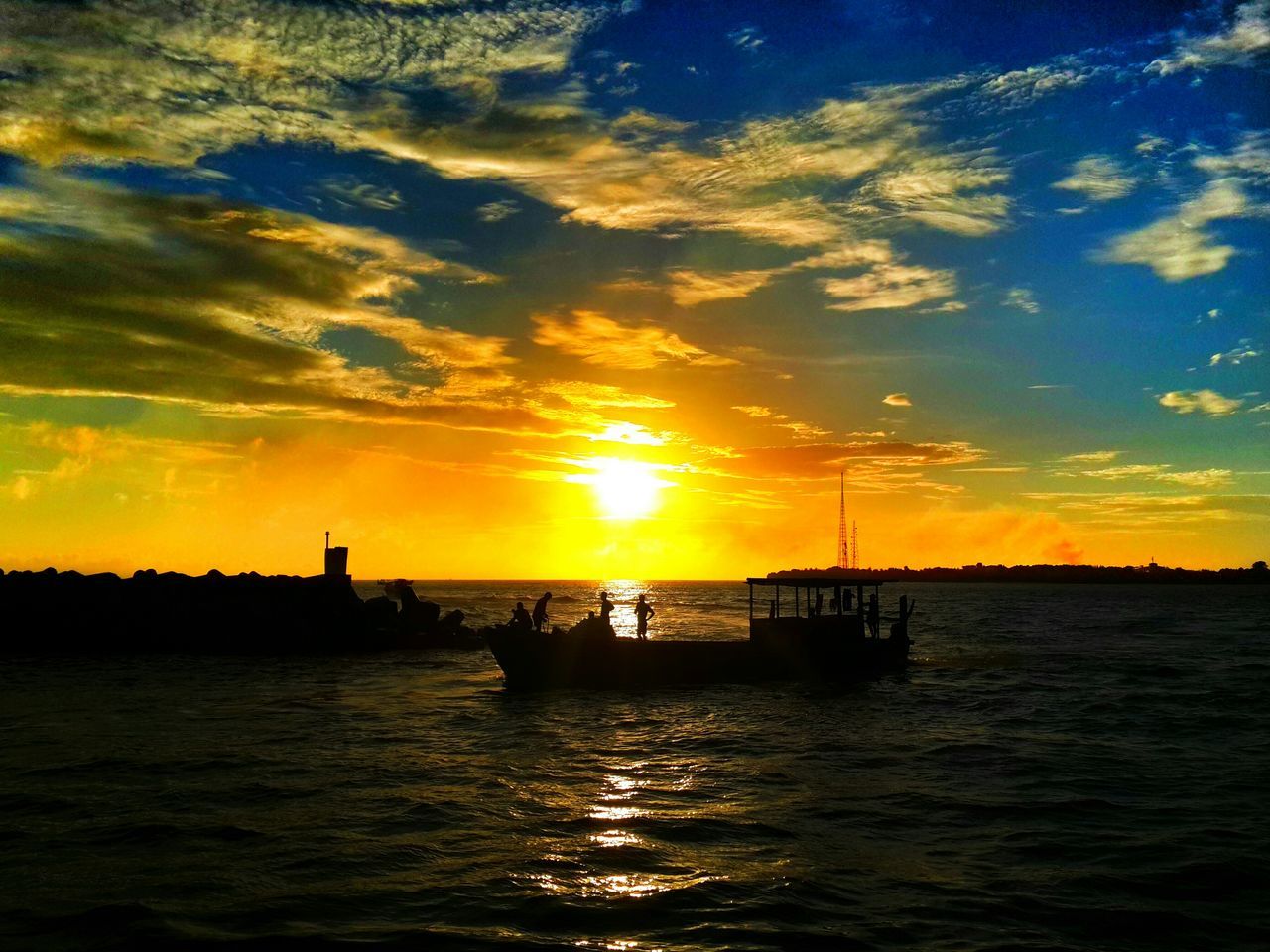 sunset, water, waterfront, silhouette, sky, rippled, sea, sun, scenics, tranquility, tranquil scene, beauty in nature, orange color, transportation, nature, idyllic, cloud - sky, nautical vessel, sunlight, reflection