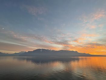 Scenic view of lake against sky during sunset