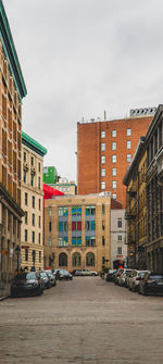 Street amidst buildings against sky