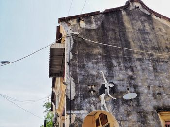 Low angle view of old building against sky