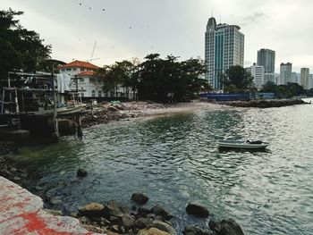 River in city against sky