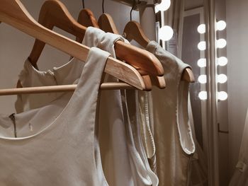 Close-up of clothes hanging in store