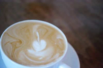 Close-up of cappuccino on table