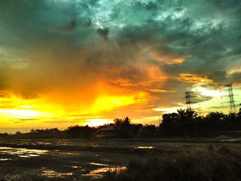 Scenic view of landscape against cloudy sky