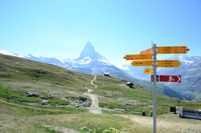 Information signs against mountains