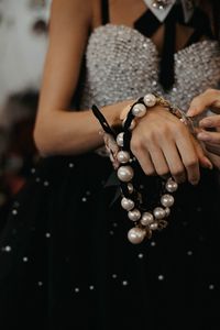 Midsection of woman holding christmas decoration