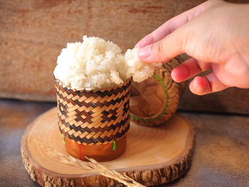 Cropped hand of person holding food