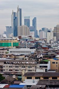 High angle view of buildings in city against sky