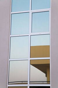 Low angle view of glass window in building