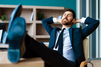 Portrait of businessman using mobile phone