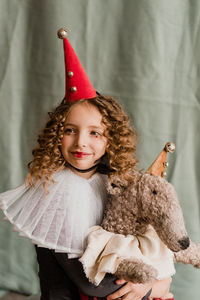 Portrait of cute girl with toy