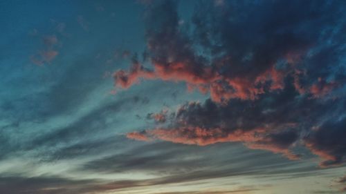 Low angle view of dramatic sky during sunset