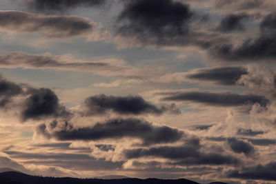 Low angle view of dramatic sky during sunset