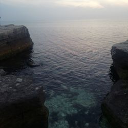 Scenic view of sea against sky at sunset