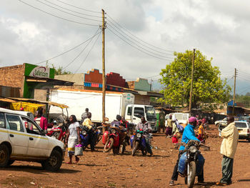 People in car against sky in city