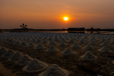 Scenic view of land against sky during sunset