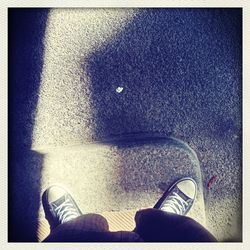 Low section of person standing on ground