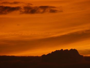 Silhouette landscape against scenic sky