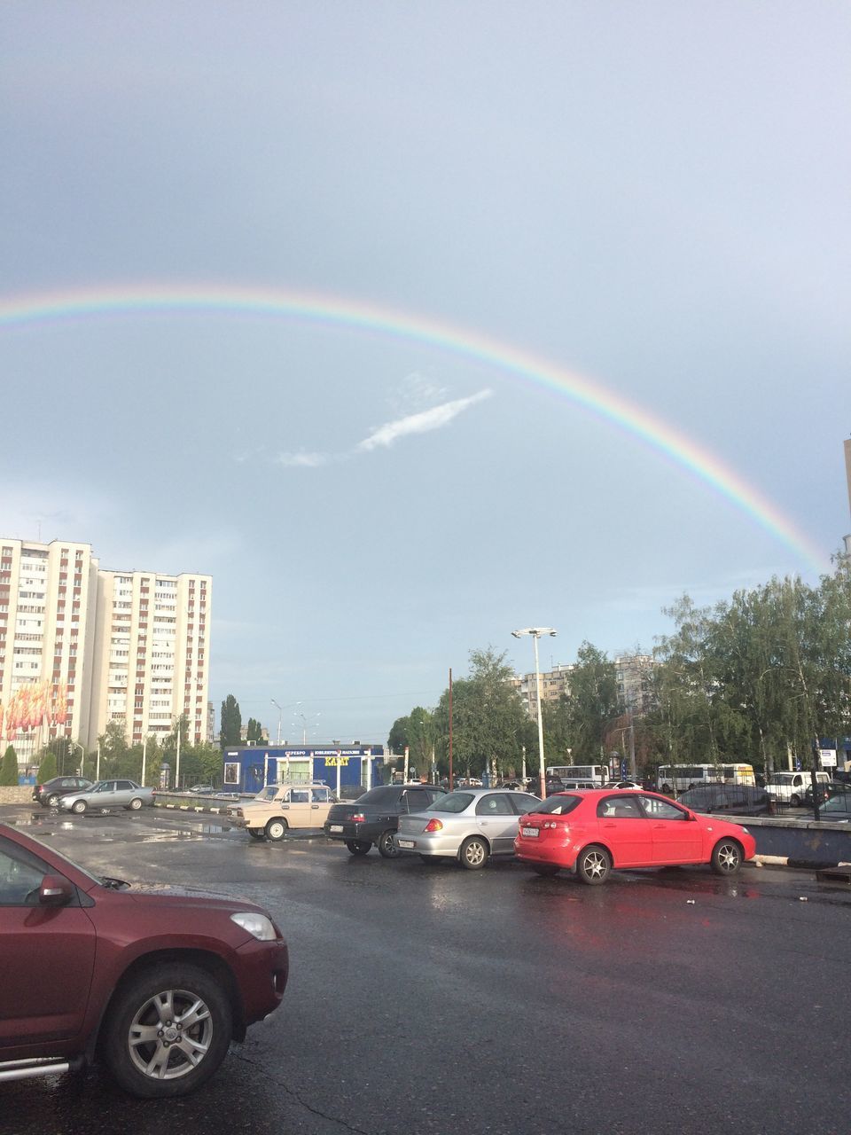 SCENIC VIEW OF RAINBOW OVER CITY