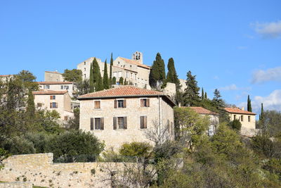 Low angle view of old building against clear blue sky