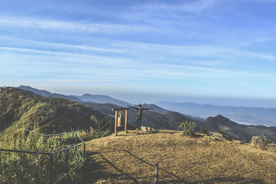 Scenic view of mountains against blue sky