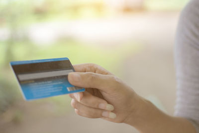 Close-up of woman hand holding credit card