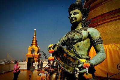 Statue of buddha against sky