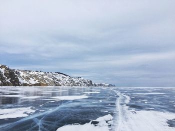 Scenic view of frozen sea against sky