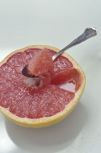 Close-up of fruit against white background