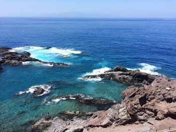 Scenic view of sea against blue sky