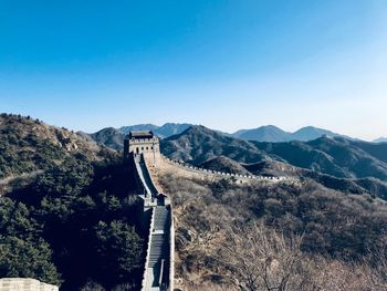 Scenic view of mountain against blue sky